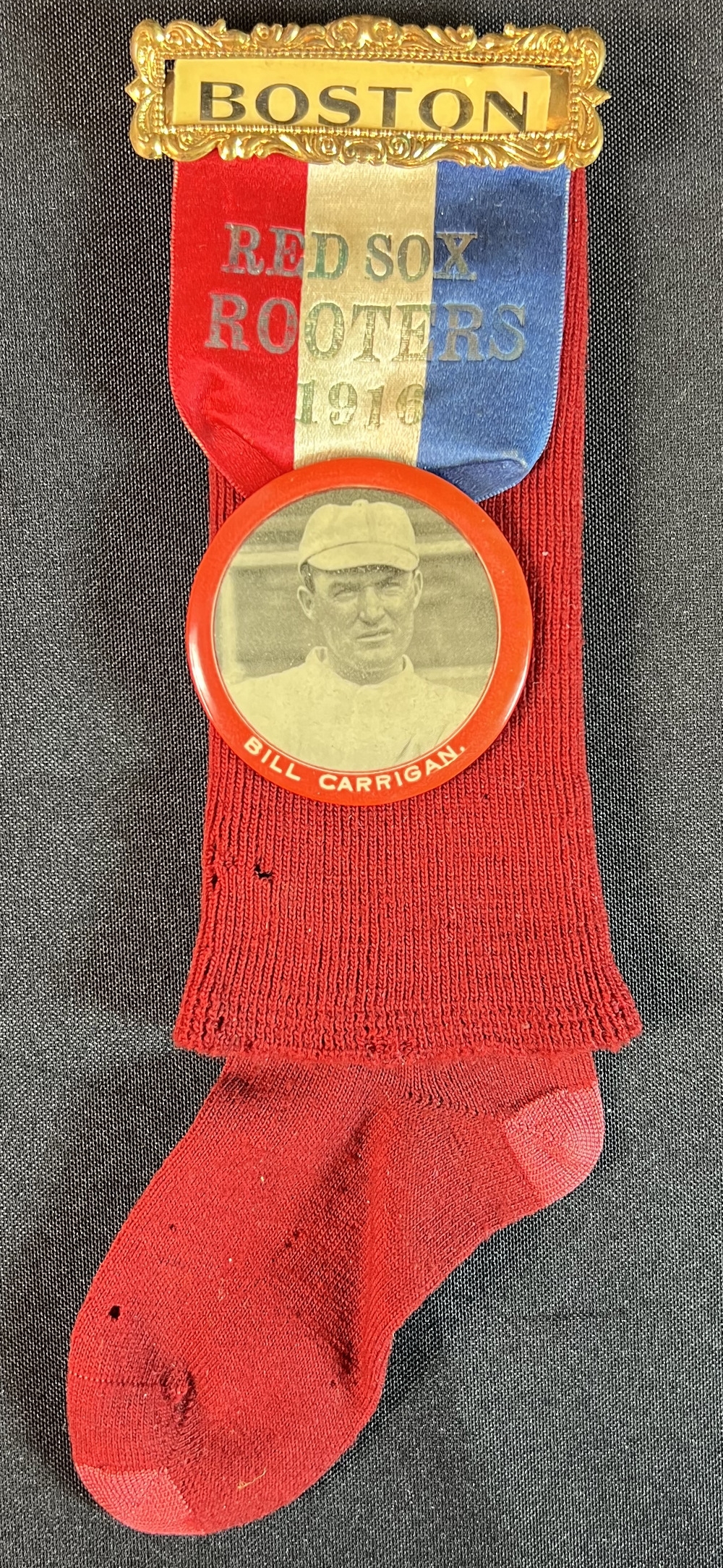 Hake's - 1916 BOSTON RED SOX ROOTERS/BILL CARRIGAN RIBBON BADGE W/BUTTON &  STOCKING.