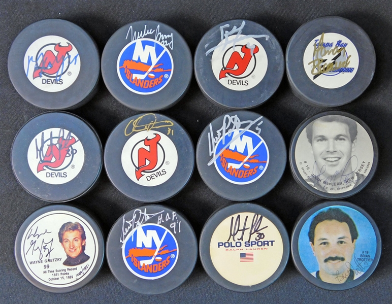 NHL Autographed Puck Group of (12) Featuring Wayne Gretzky JSA
